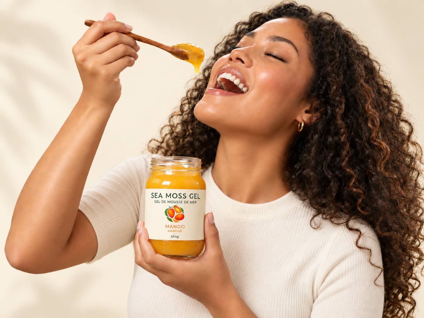 Woman enjoying PreMoss mango sea moss gel